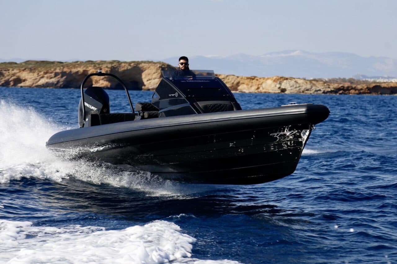 TechnoHull GT7 at speed — deep-V hull, bow-on
